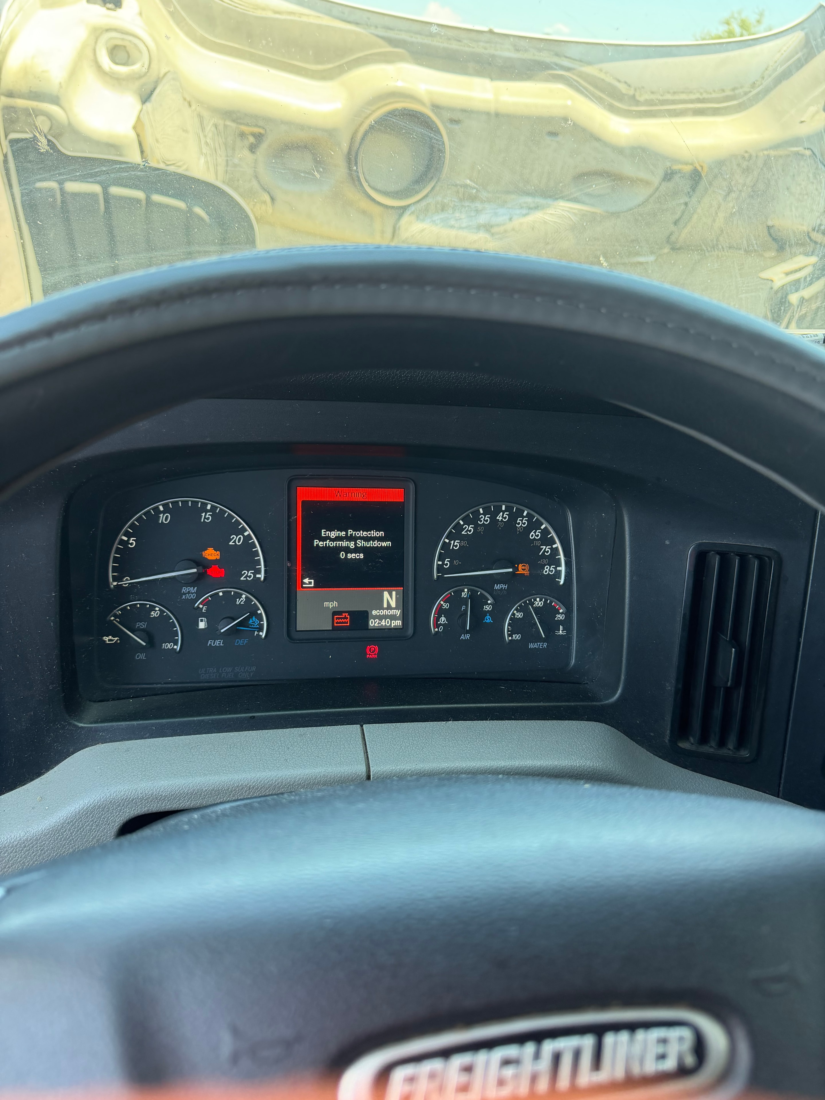 Freightliner Cascadia dashboard showing Engine Protection Performing Shutdown warning — semi truck engine shutting off due to low coolant level fault triggered by bad coolant level sensor in Mesa AZ, repaired by RoadWrench mobile semi truck mechanic