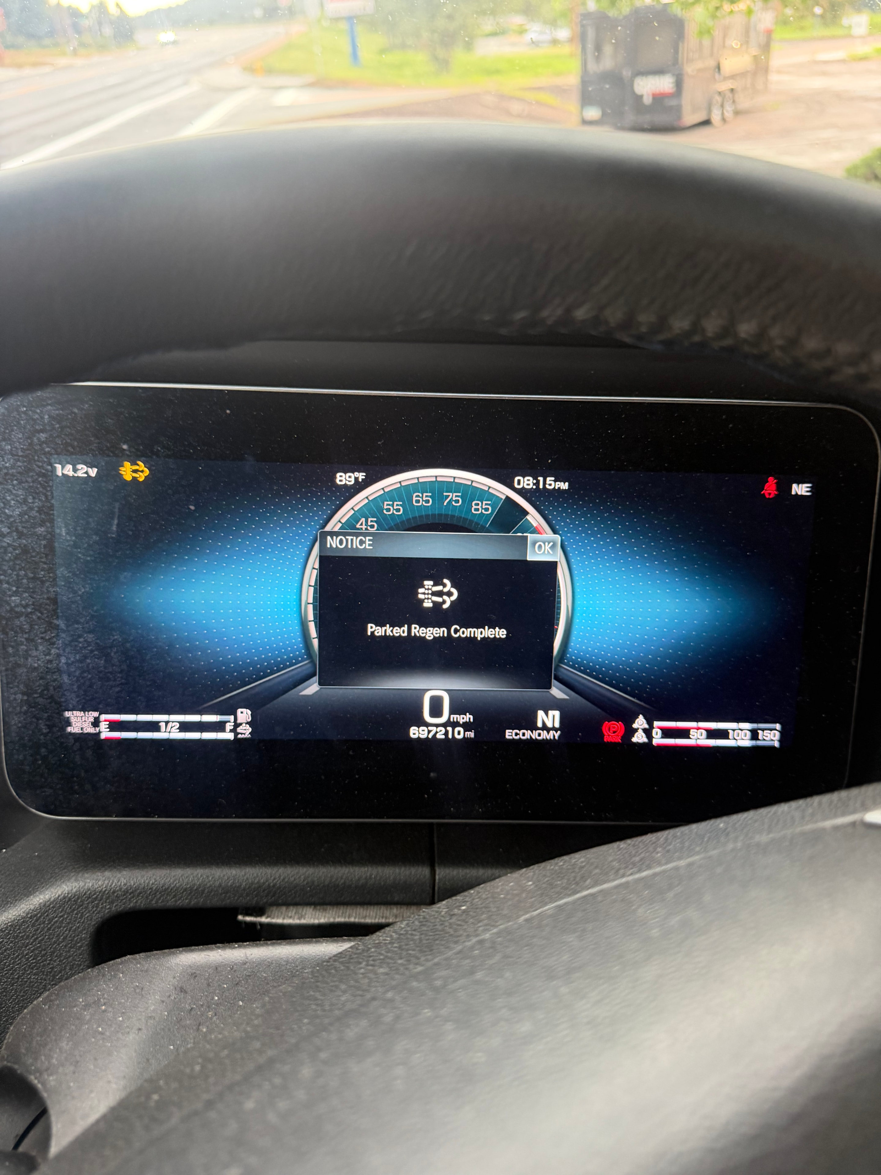 Freightliner Cascadia dashboard showing Parked Regen Complete notice with fault lights cleared — DPF derate resolved by RoadWrench mobile semi truck mechanic near Phoenix AZ