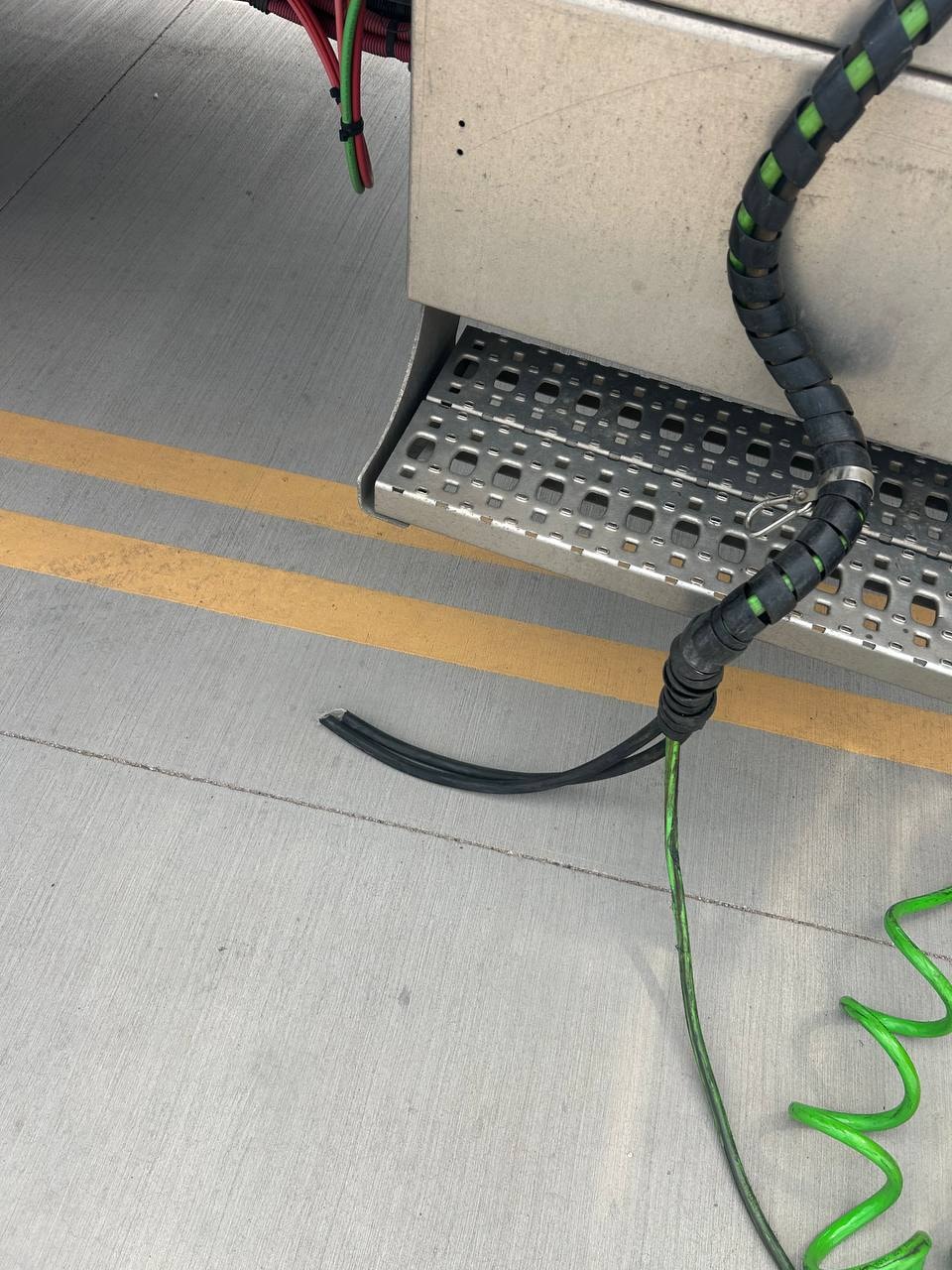 Disconnected and ruptured air and electric lines at Strick trailer gladhand and QBox connection panel — dangling air hoses and severed electrical cables on semi truck trailer requiring emergency mobile mechanic repair in Gilbert AZ