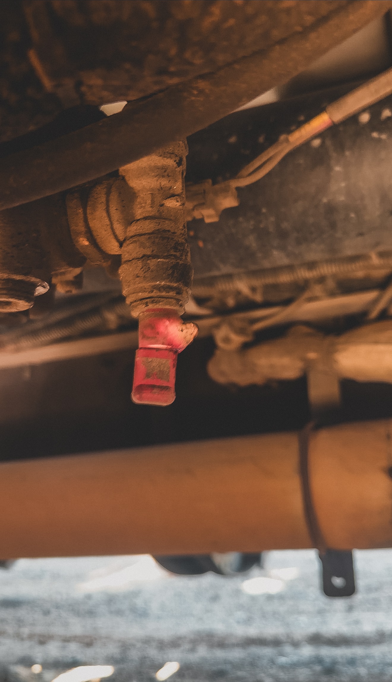 Broken air line fitting on Western Star semi truck air dryer — leaking red push-to-connect fitting on air brake system requiring emergency roadside repair in Chandler AZ